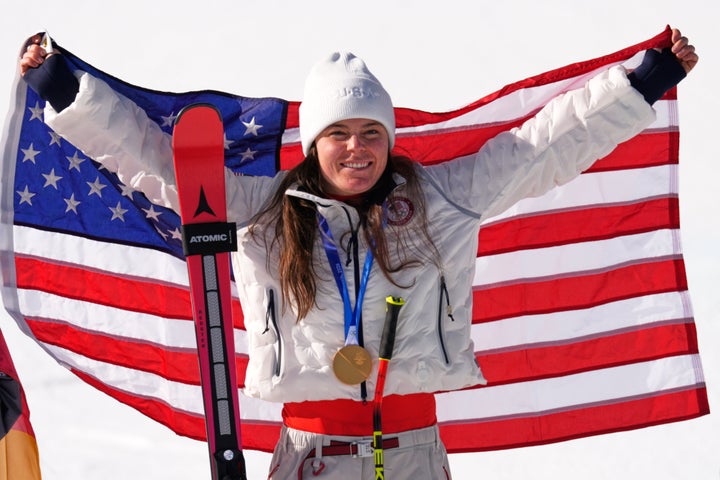 United States' Breezy Johnson celebrates winning the gold medal in the alpine ski women's downhill race, at the 2026 Winter Olympics, in Cortina d'Ampezzo, Italy, Sunday, Feb. 8, 2026. (AP Photo/Robert F. Bukaty)